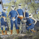 A five-person superhero team in matching blue outfits.